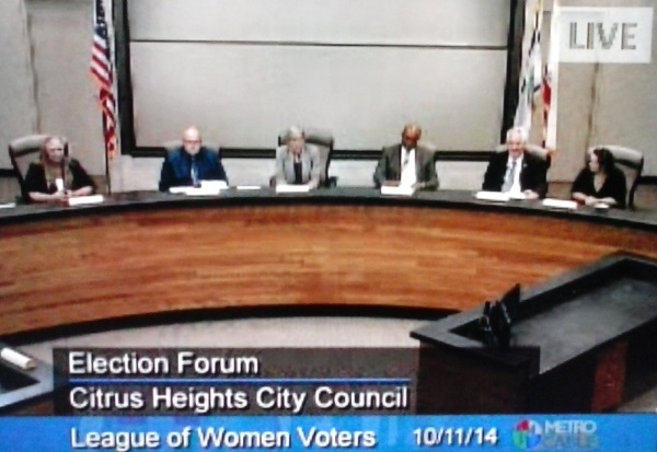 The five city council candidates seated next to a League of Women Voters moderator at Saturday's forum. 
