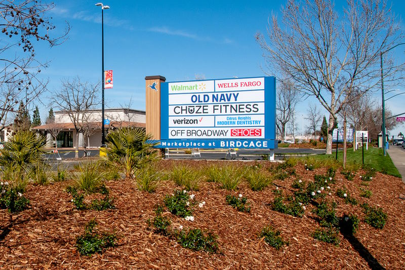New signage, landscaping visible along Sunrise Blvd