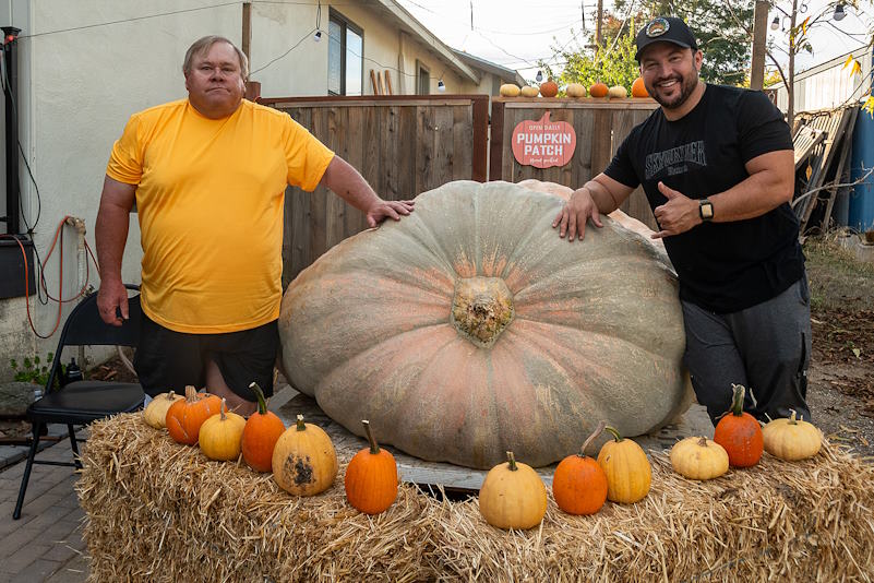 Ron Root (L) and Nick Kennedy (R) with one of the pumpkins the team grew in the 2023 season. A larger pumpkin than the one pictured here broke the state record for largest pumpkin in California, and placed second worldwide.