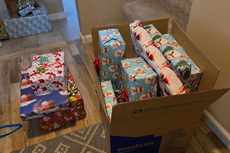Multiple Christmas gifts were wrapped during a wrapping party by CHASEN members and volunteers and then distributed to children of families in need as part of the neighborhood group’s annual Giving Tree project. // Courtesy of Bill Shirley
