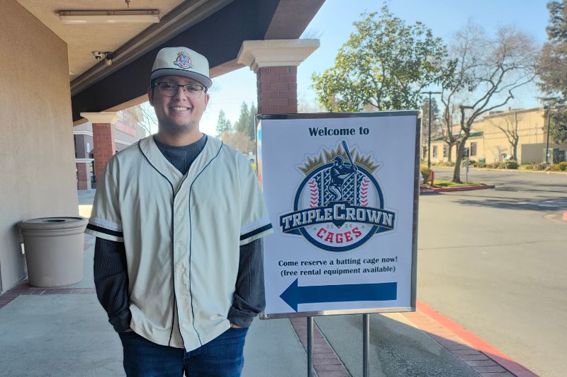 Softball training facility business owner Ryan Cappas stands in front of his new business, Triple Crown Cages, 7255 Greenback Ln.