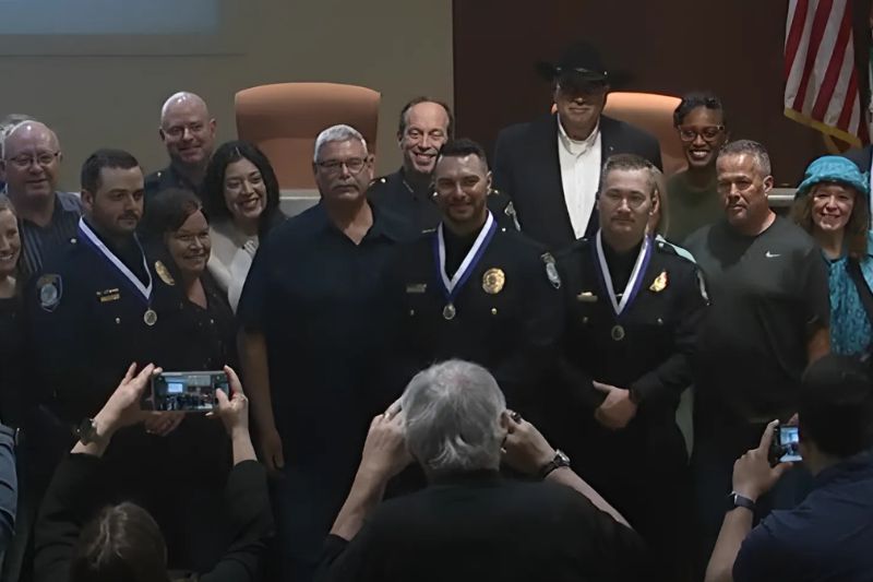Citrus Heights Police Officers Sheldon Hansen, Christopher Edwards, and Hayden LaCurelle stood with loved ones, City Council members, City staff and Citrus Heights Police Chief Alex Turcotte for a photo after accepting Distinguished Service medals on Wednesday, Feb. 26, 2025,