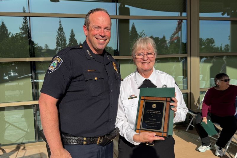 Citrus Heights Police Chief Alex Turcotte stands with Chip-in Hall of Fame Award winner Janet Harry, at a Volunteer Appreciation Week ceremony, April 23, 2025. // City of Citrus Heights