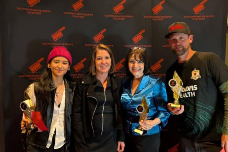 Mesa Verde Alum Chris Laird stands with fellow cast members and the writer of "The Jacket" during the SacTown Movie Buffs Film Festival on April 26, 2025. From left to right: Rising Star winner Rona Bernadette, Best Original Screenplay writer Cheryl Bealer-Wynton, Best Supporting Actress winner Janine Romney, Best Actor winner Chris Laird. // Chris Laird