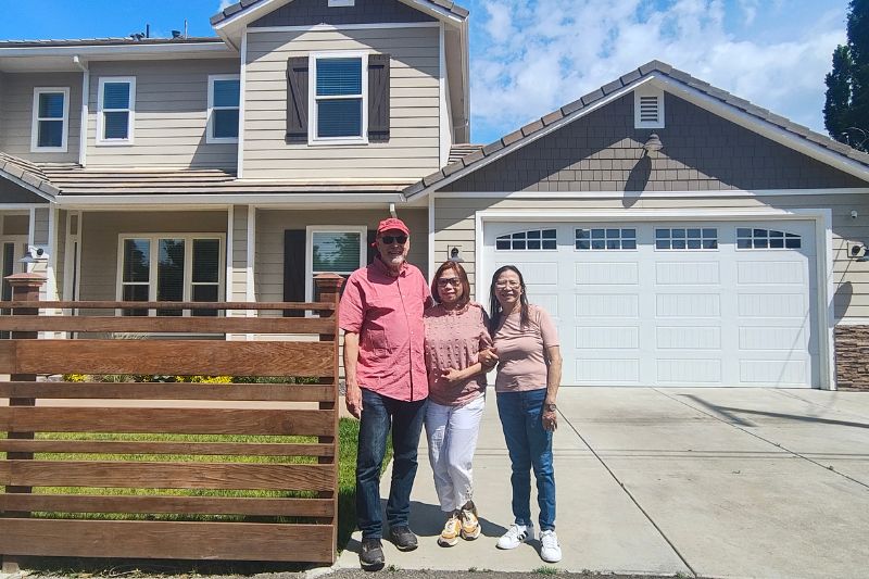 Larry Fritz stands with his wife, Maria Fritz, and mother-in-law Lucy Pitogo in front of his new home in Citrus Heights