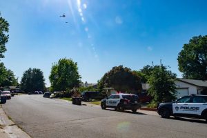 Two law enforcement helicopters along with several CHPD vehicles could be seen along Meadowcreek Way as officers searched the creek bed for an assault suspect. // SB Williams