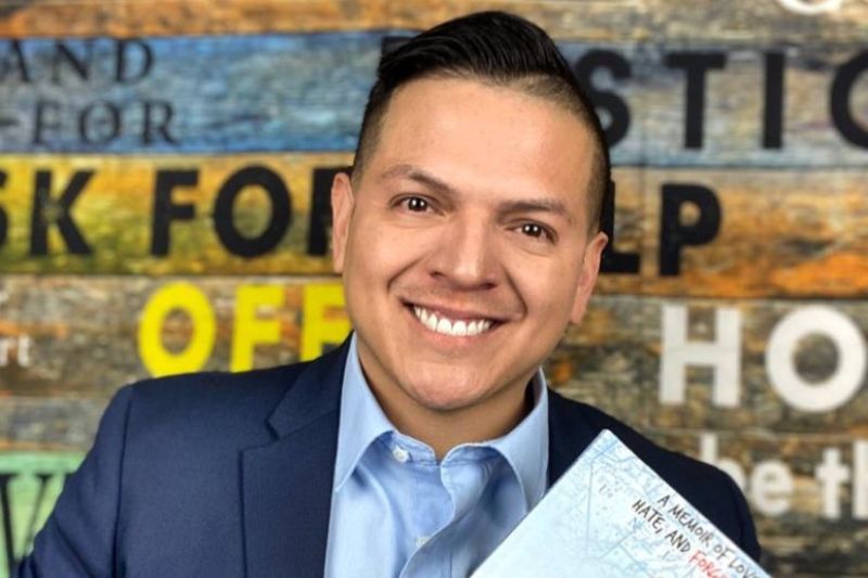 Nonfiction Author Ray Juarez Jr. holds his latest book, "Homeless by Choice: A memoir of Love, Hate, and Forgiveness." // Courtesy of Ray Juarez Jr. PR team