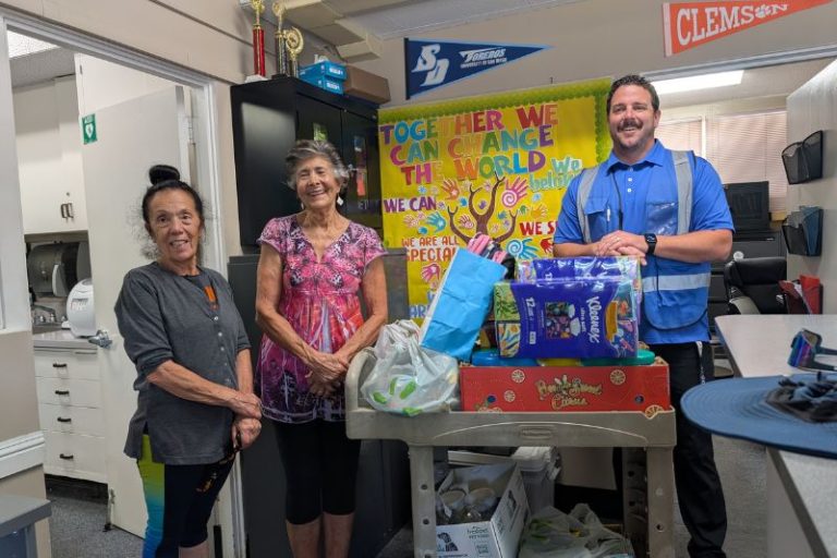 Area 11 board members stand with Kingswood K-8 VP with a cart of school supplies donated by Area 11 on Thursday, Aug. 21, 2025. From left to right, Area 11 president Jodi Ash, treasurer/secretary Kathy Wright, Kingswood K-8 VP Eric Roesser. // SB Williams