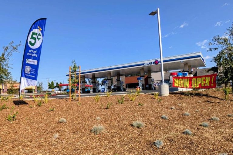 A "NOW OPEN" banner hangs in front of a new gas station and Sonic Drive In on Antelope Rd. and Roseville Rd.