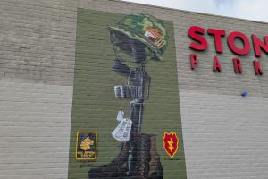 A veteran-themed mural graces the wall of Stones Gambling Hall's parking garage. // SB Williams
